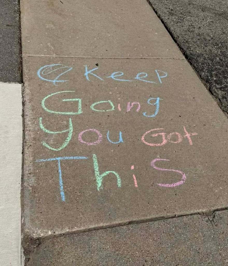 idewalk chalk message reading “Keep Going You Got This.”